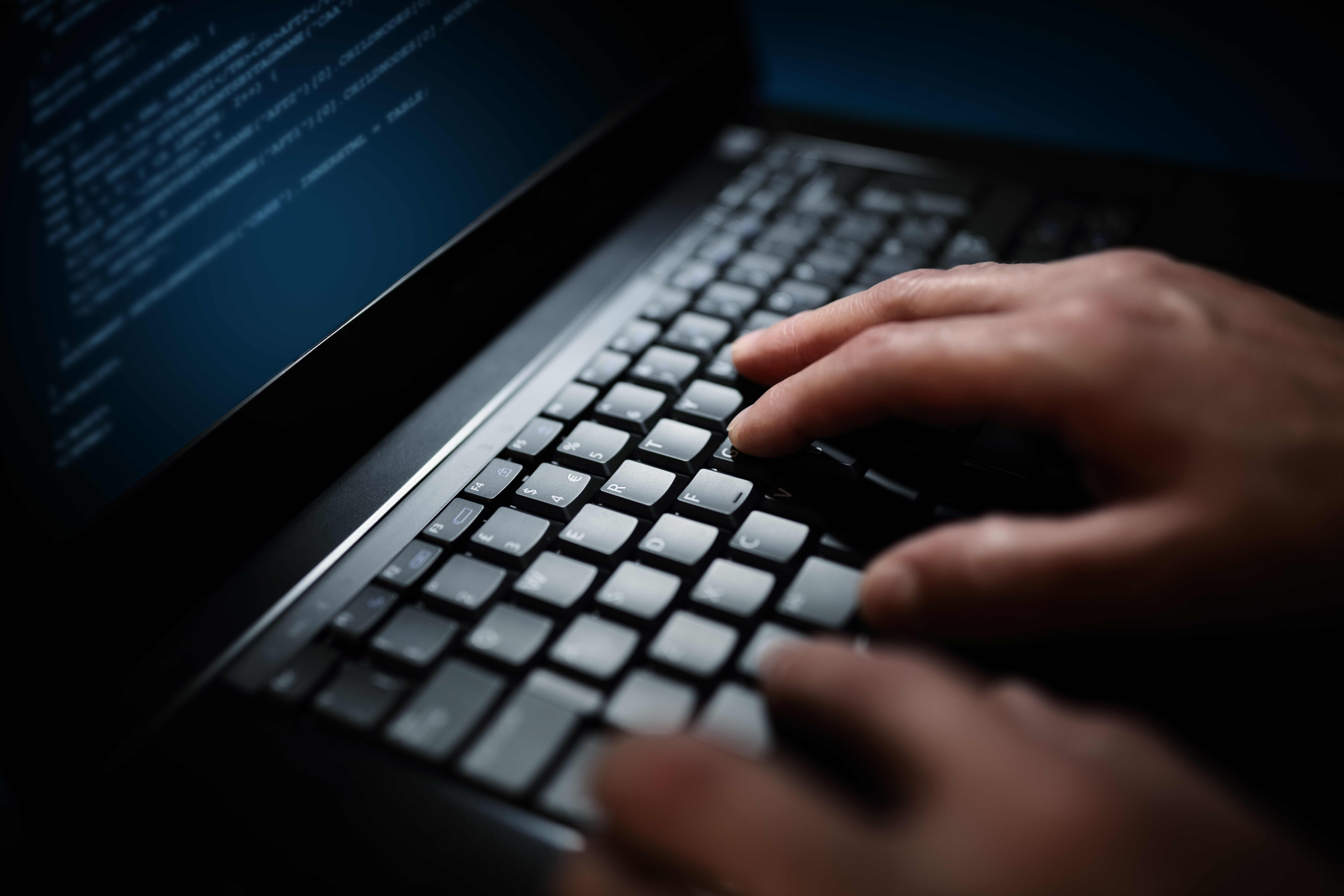 programmer-or-computer-hacker-typing-on-laptop-PSAN67J programmer-or-computer-hacker-typing-on-laptop-PSAN67J